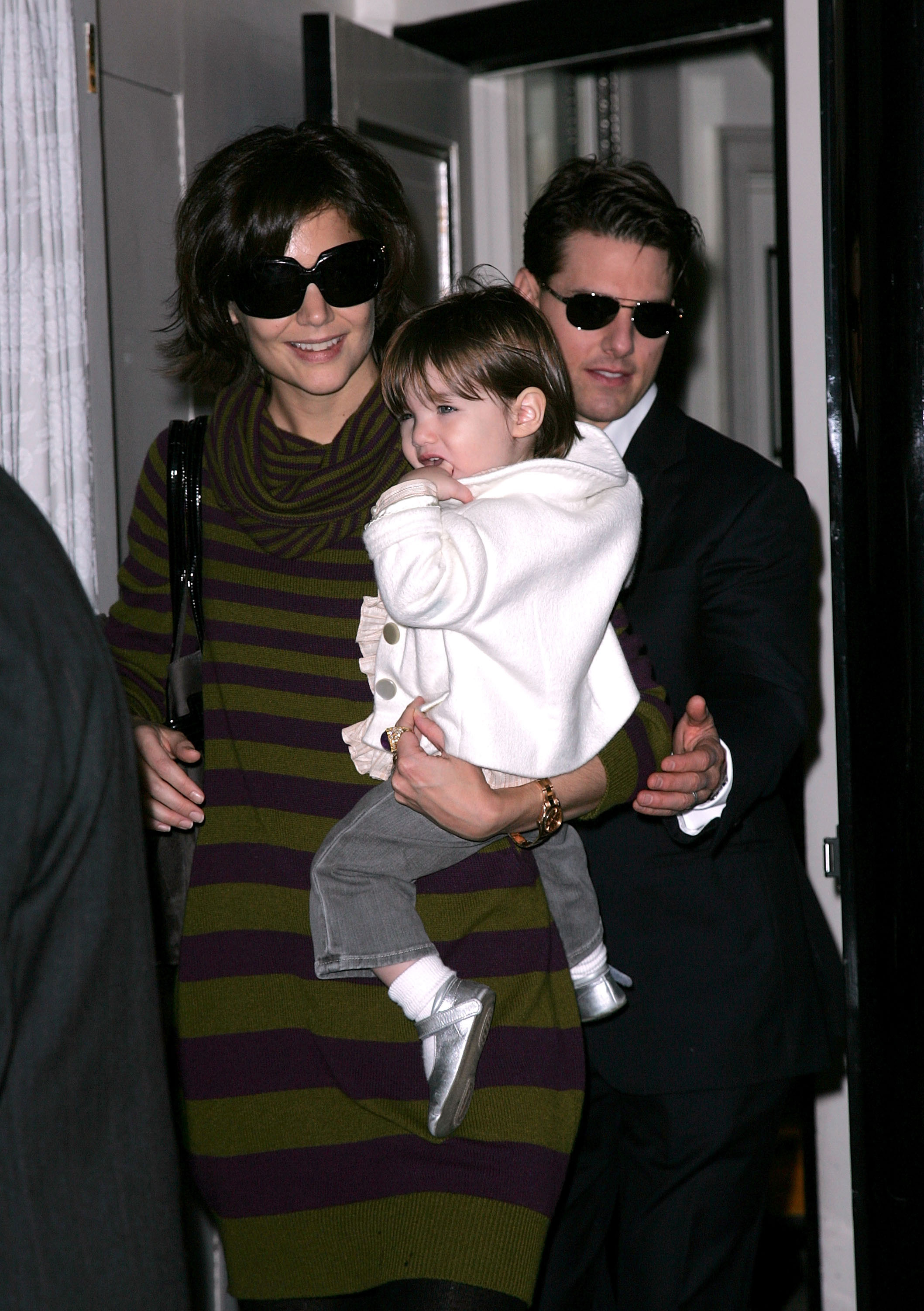 Katie Holmes and Tom Cruise with their daughter Suri in New York City on October 19, 2007 | Source: Getty Images