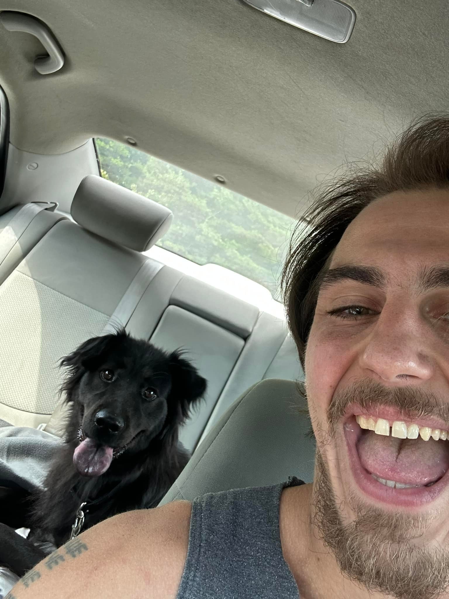 Adam Turck poses with his dog in a photo shared on September 14, 2023. | Source: Facebook/Adam Turck
