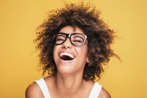 A woman laughing. | Source: Shutterstock.