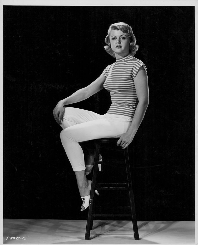 Angela Lansbury, wearing white trousers and a striped blouse, 1955. | Source: Getty Images
