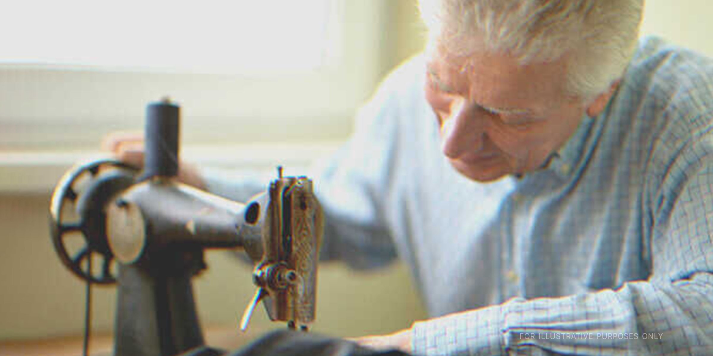 Older man sewing a dress | Source: Shutterstock