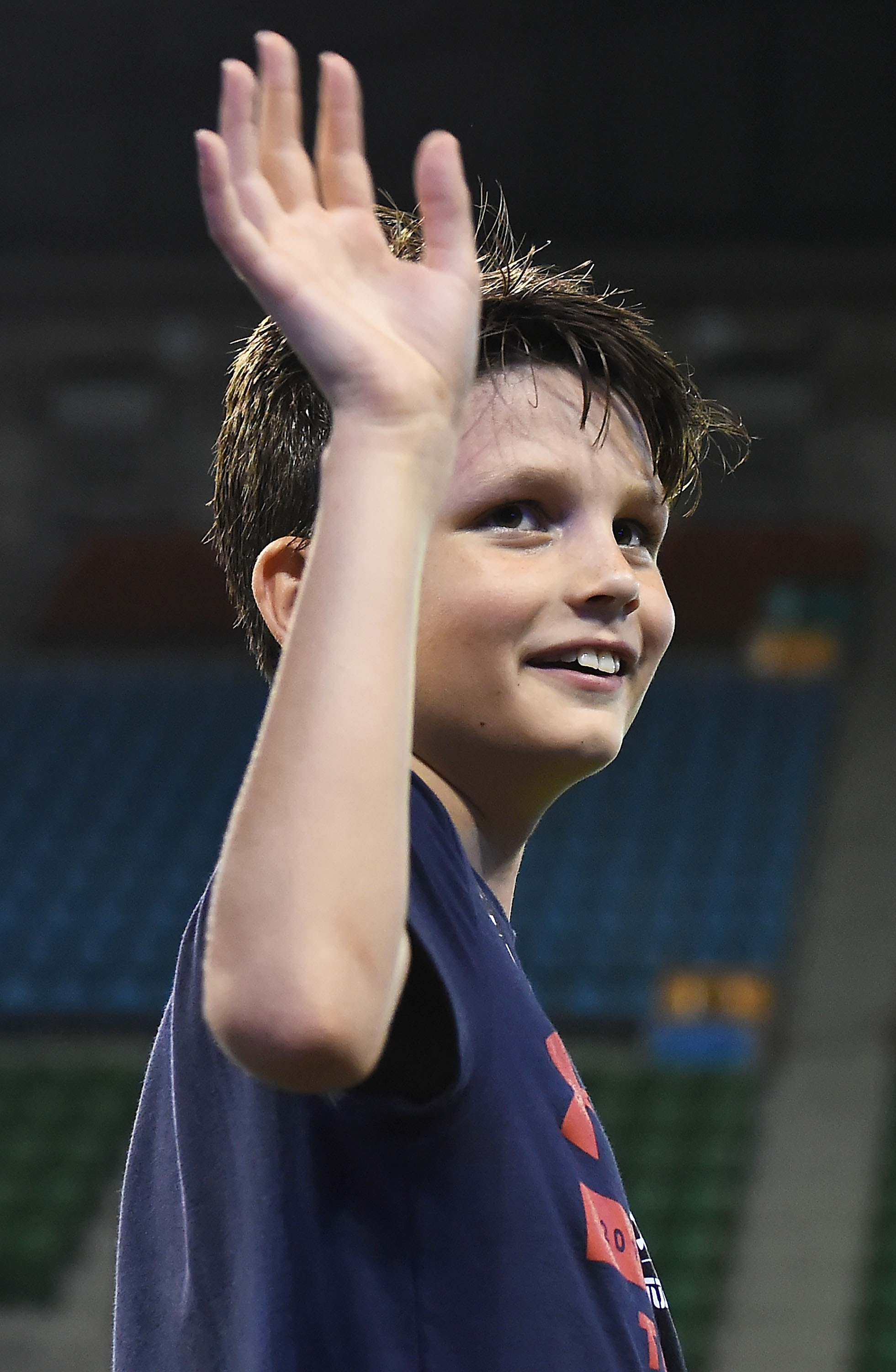 Jack Moynahan smiles and waves to the crowd while attending his dad's Under Armour Asia Tour in Tokyo, Japan. His presence highlights how much he had grown by 2017.