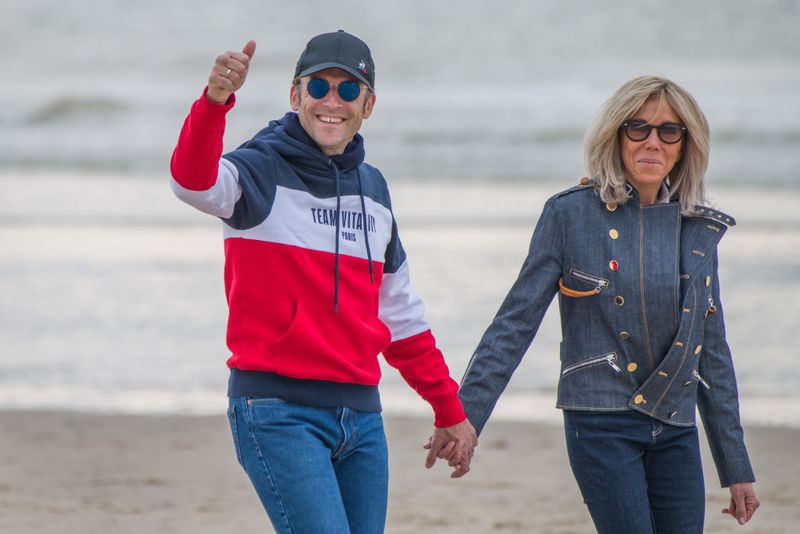 The Macrons held hands while walking along the beach in Le Touquet-Paris-Plage on April 23, 2022. Known as a frequent retreat for the couple, the town has long served as a quieter backdrop away from the political spotlight surrounding their highly public life.