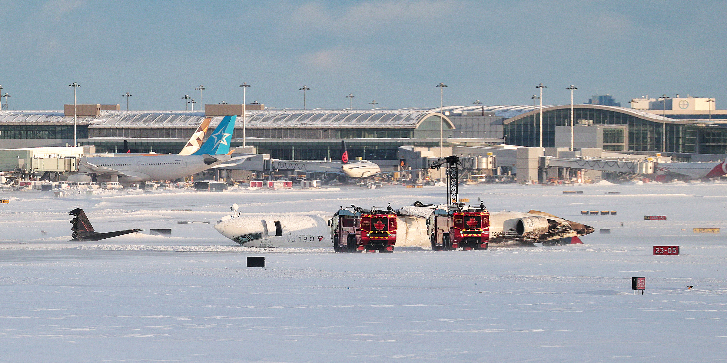 Emergency personnel work at the scene of a Delta Air Lines plane crash on February 17, 2025, in Toronto, Canada. | Source: Getty Images