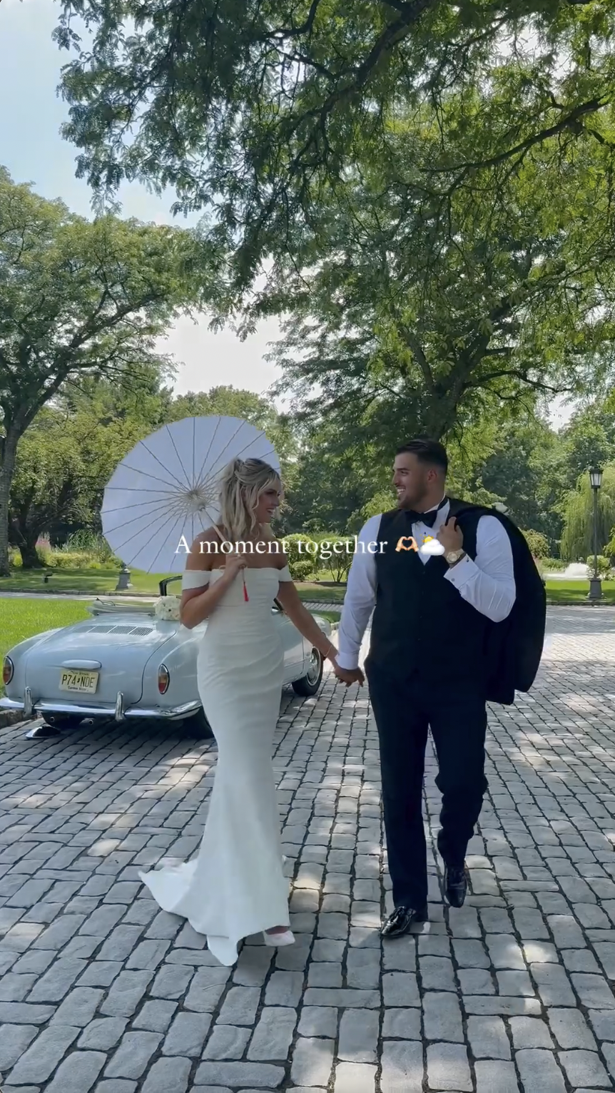 Victoria Schultz and Jon Runyan Jr. posing next to a vintage car, posted on July 10, 2024 | Source: Instagram/antpagephoto, alenkafilms and victoriajrunyan