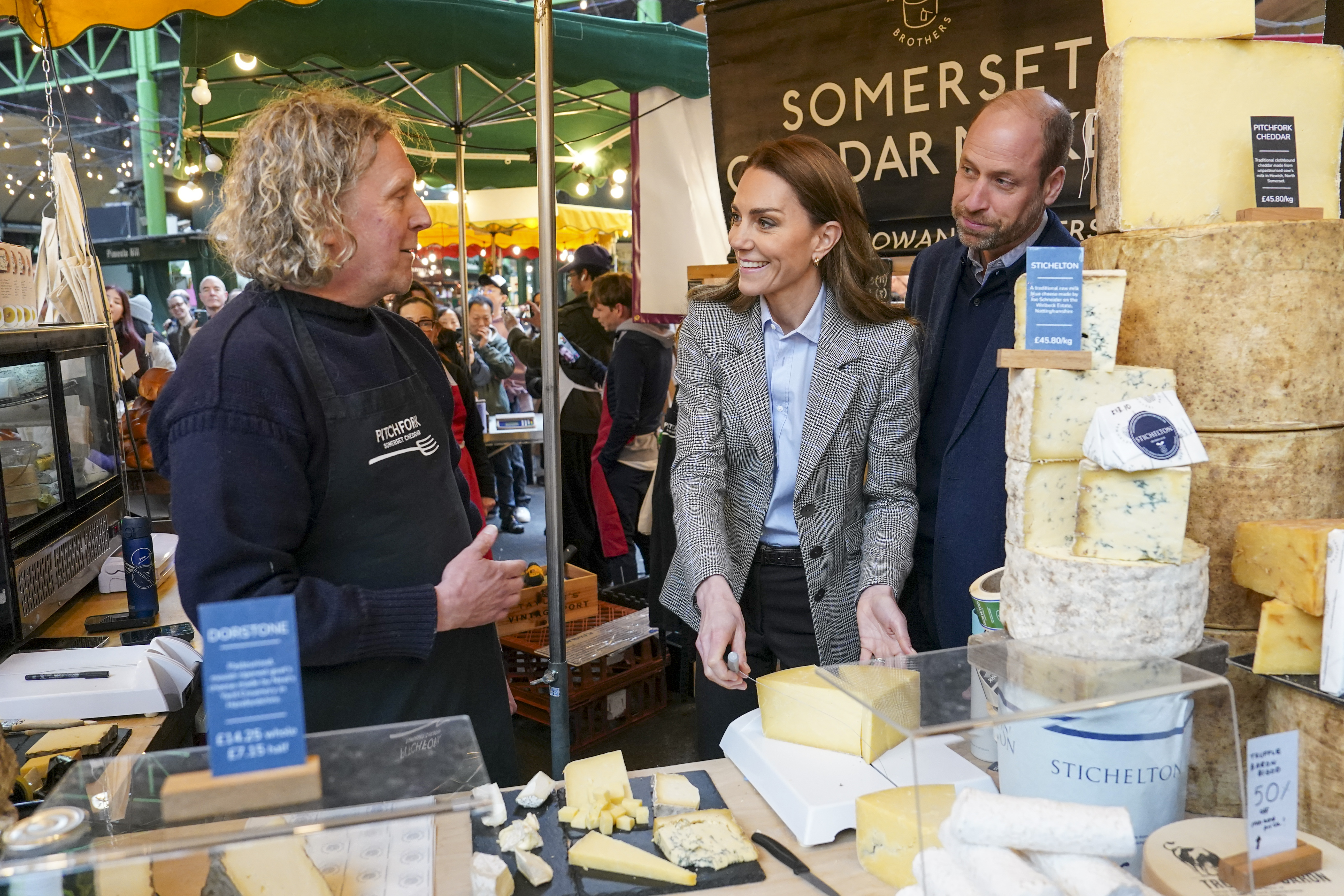 Catherine, Princess of Wales and Prince William, Prince of Wales, speak to Todd Trethowan while sampling one of his cheeses during a visit to Borough Market on 12 March 2026 in London, England. | Source: Getty Images