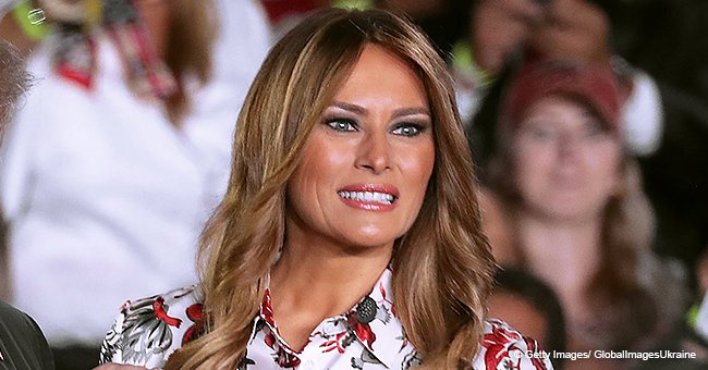 Melania dons a white and red floral dress as she unveils a children’s hospital healing garden
