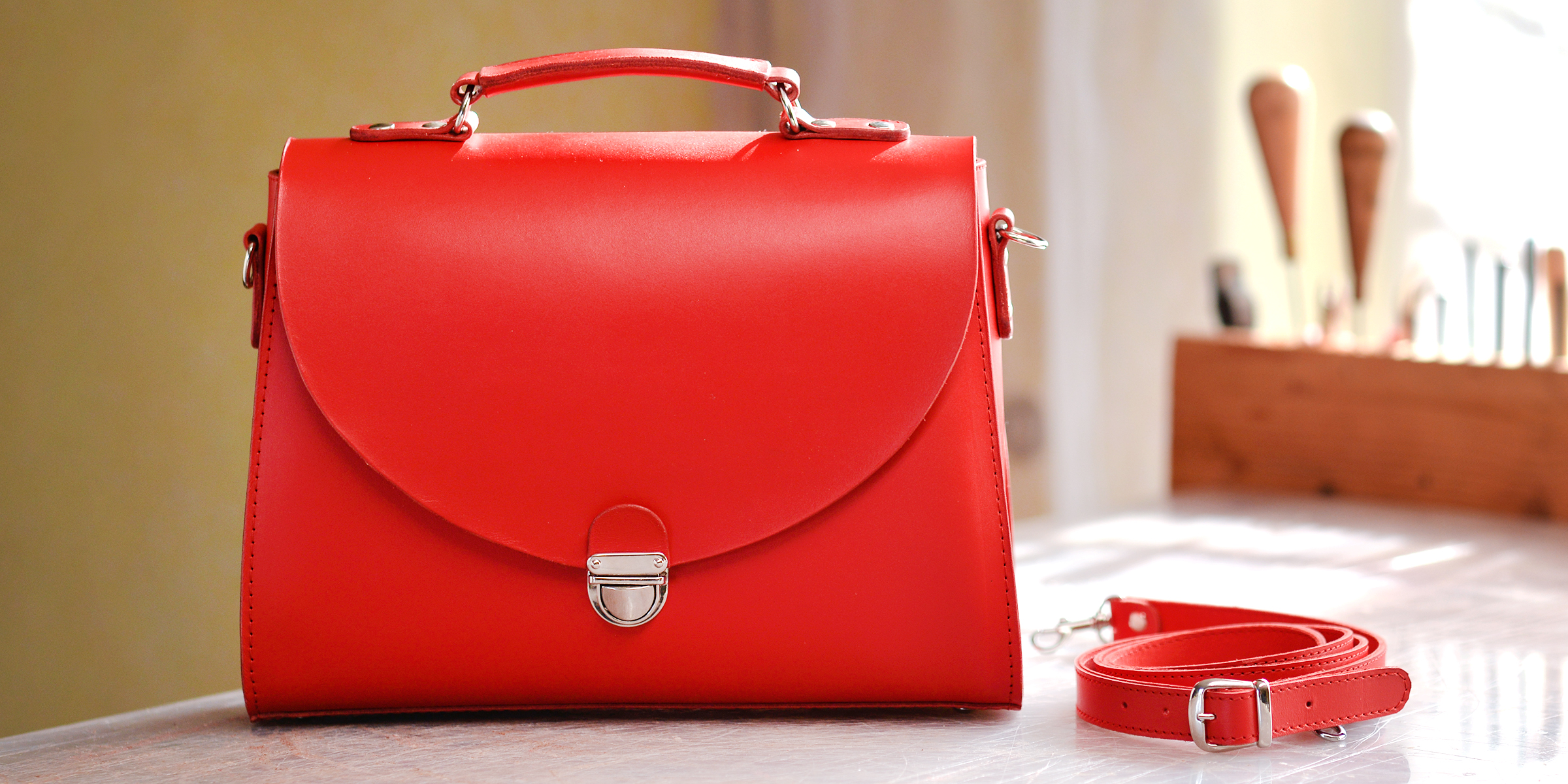 A red purse on a table | Source: Shutterstock