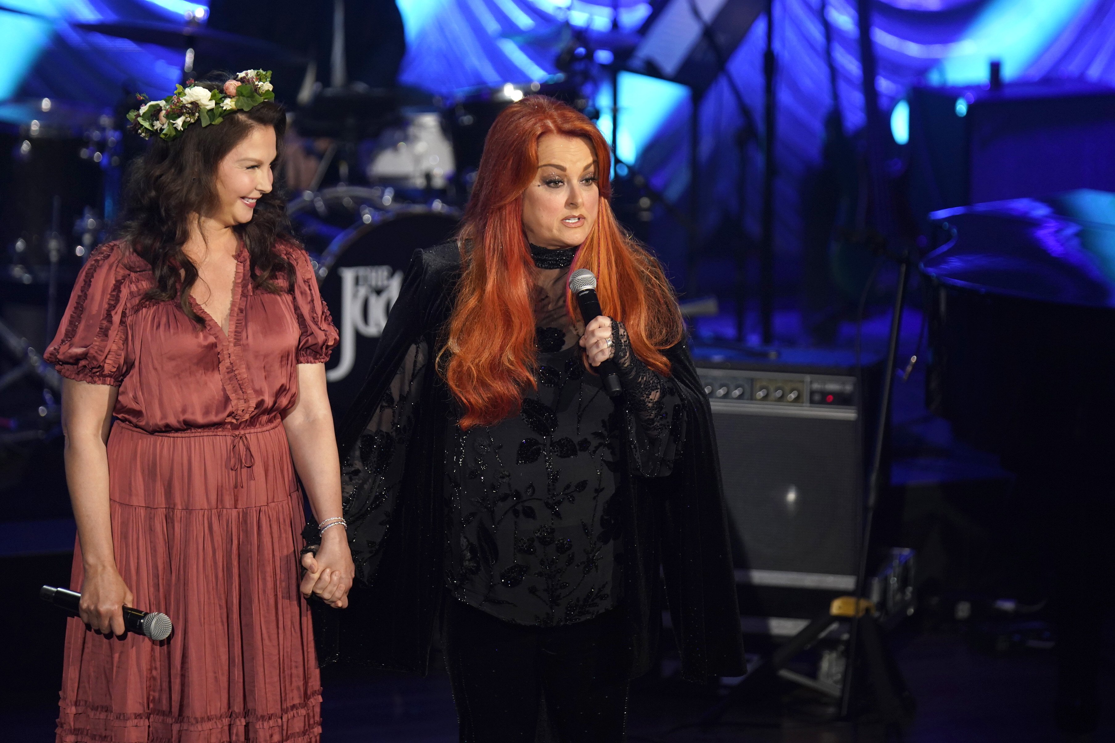 Ashley Judd and Wynonna Judd speaking onstage during Naomi Judd: "A River Of Time" Celebration at Ryman Auditorium on May 15, 2022 in Nashville, Tennessee. | Source: Getty Images