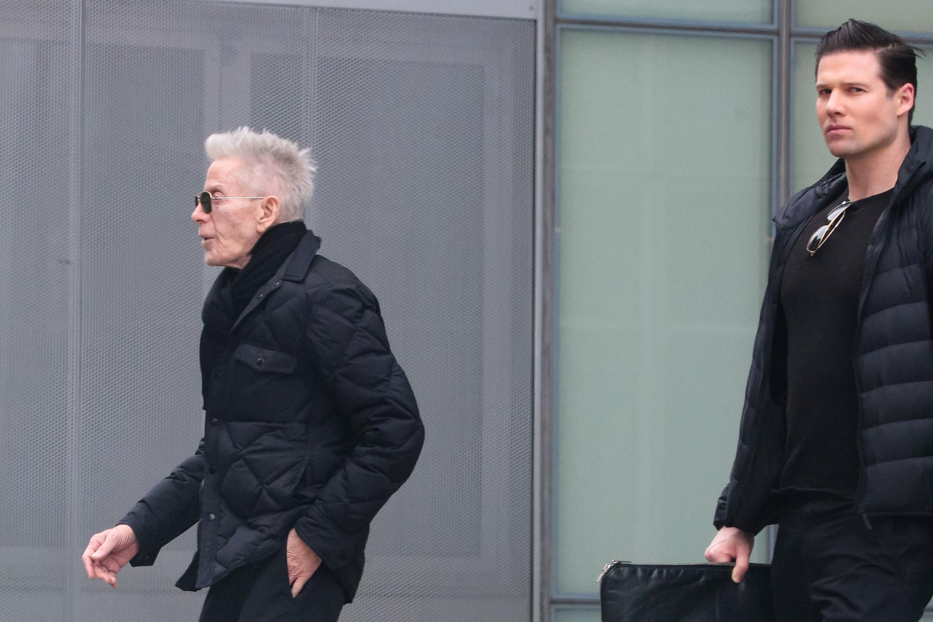 Bundled up in quilted jackets, Calvin Klein and Kevin Baker were photographed walking through New York City on January 15, 2024. Dressed in matching black and keeping a steady pace, the couple maintained their trademark discretion while navigating the streets, offering another fleeting glimpse into their long-standing, private relationship.