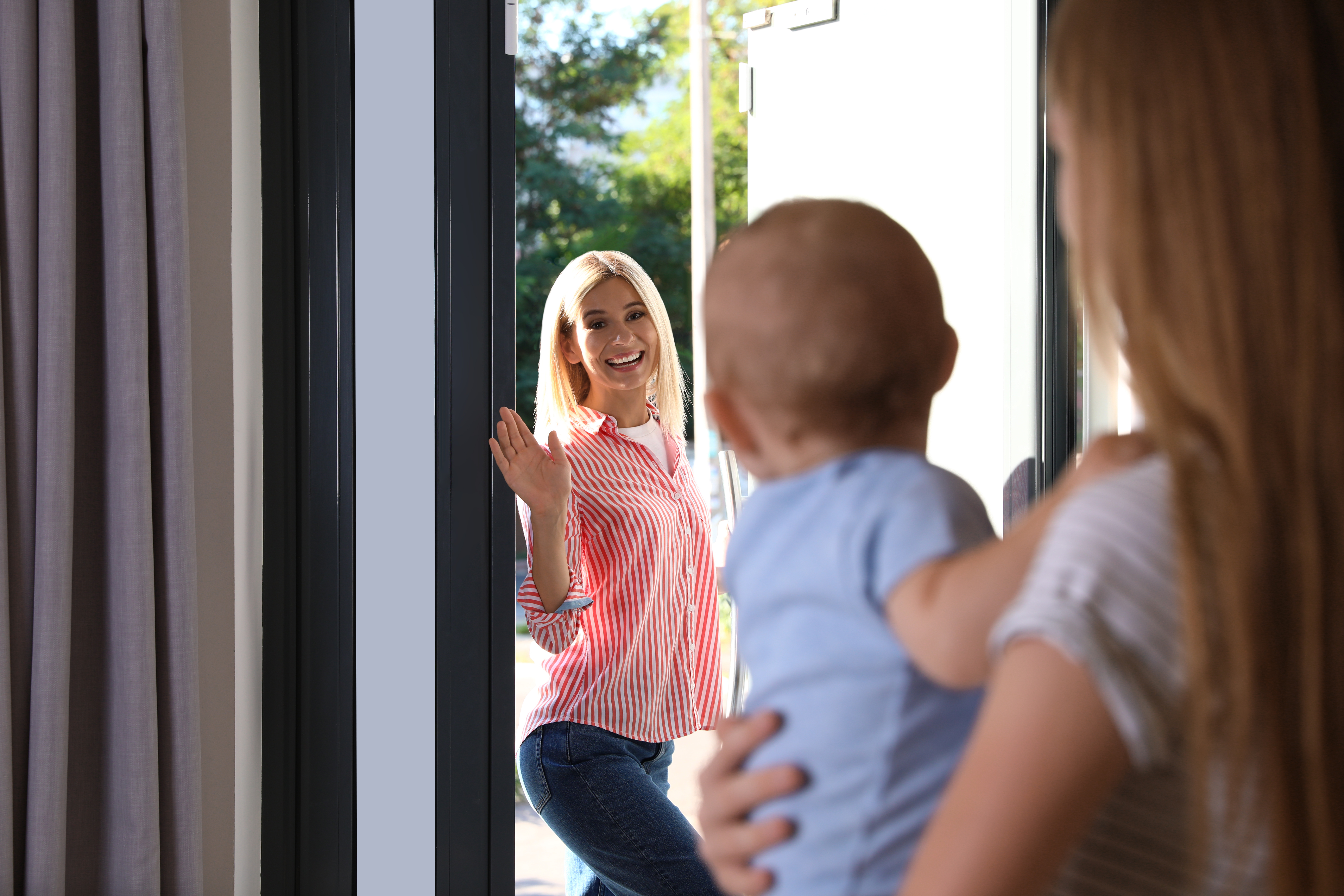 Mother leaving her baby with a teen nanny at home | Source: Shutterstock