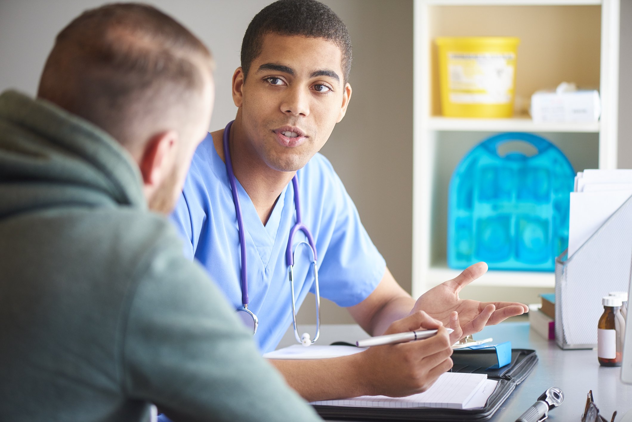 Photo of a doctor with his male patient. | Photo: Getty Images