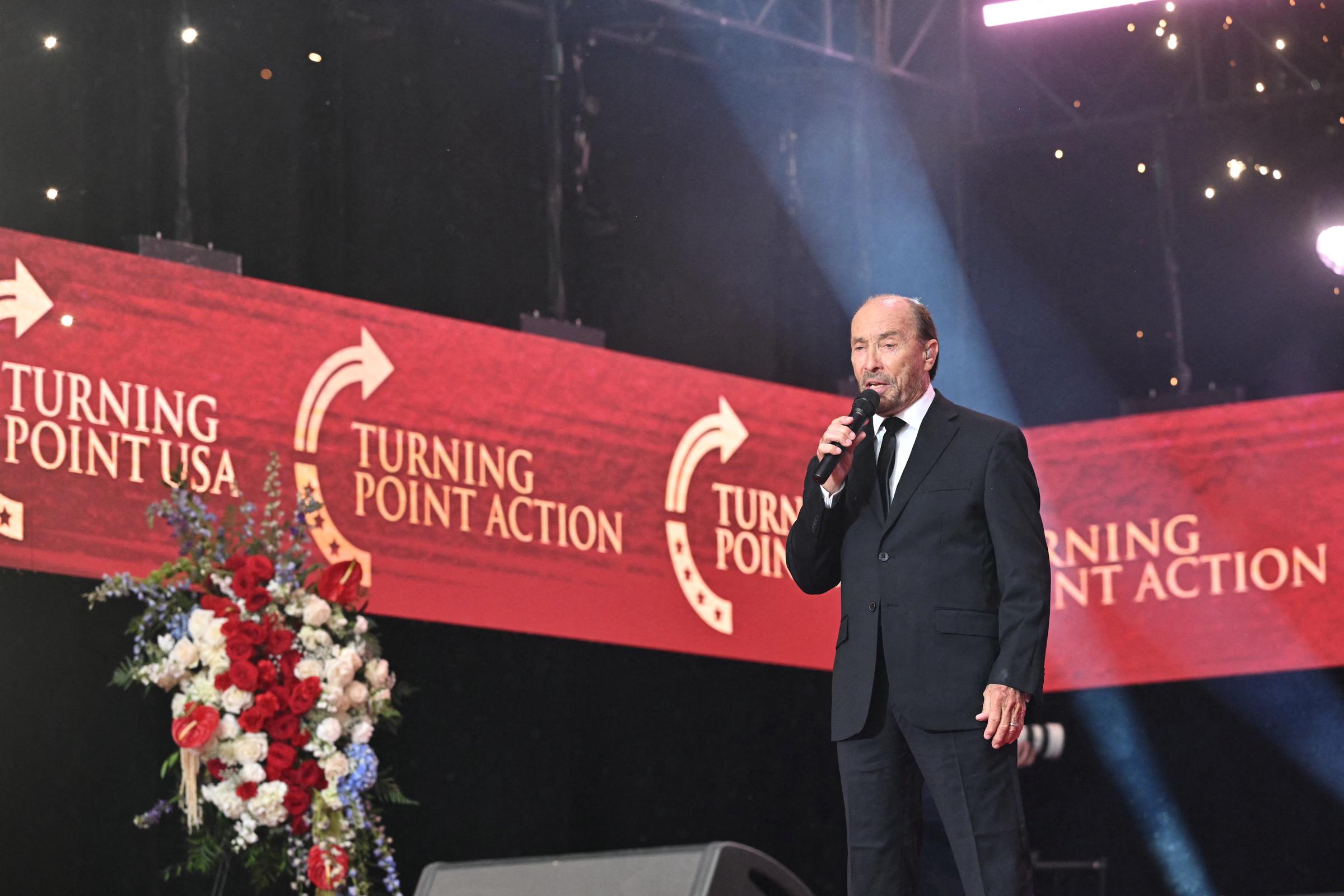 Lee Greenwood performs at the public memorial service for Charlie Kirk at State Farm Stadium on September 21, 2025, in Glendale, Arizona | Source: Getty Images