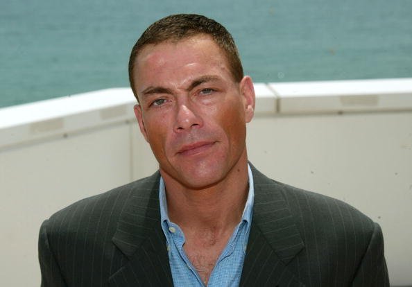 Actor Jean-Claude Van Damme poses during a photocall on the roof at the Noga Hilton during 56th International Cannes Film Festival 2003 on May 18, 2003, in Cannes, France. | Source: Getty Images.