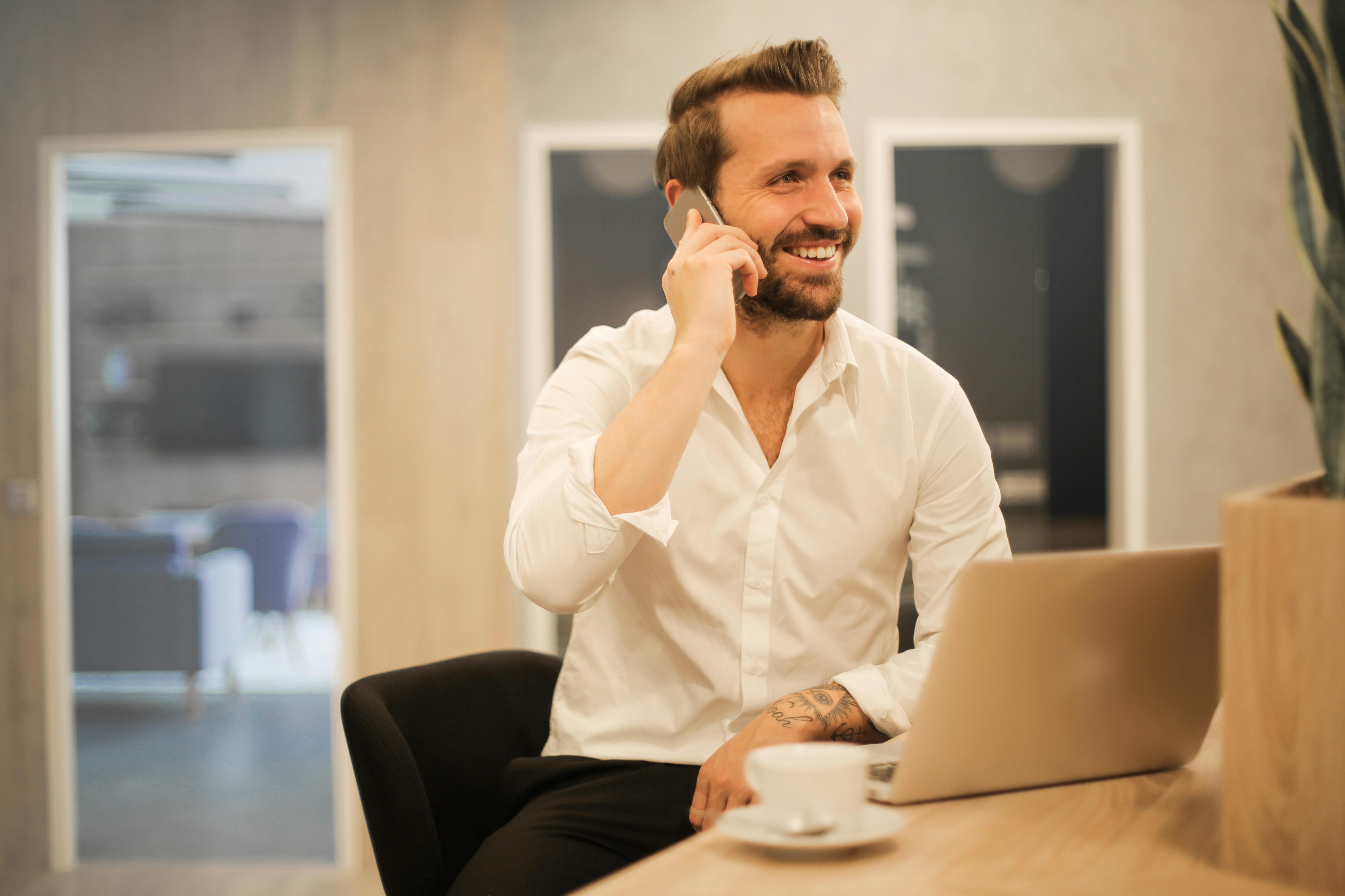 A happy man on a call | Source: Pexels