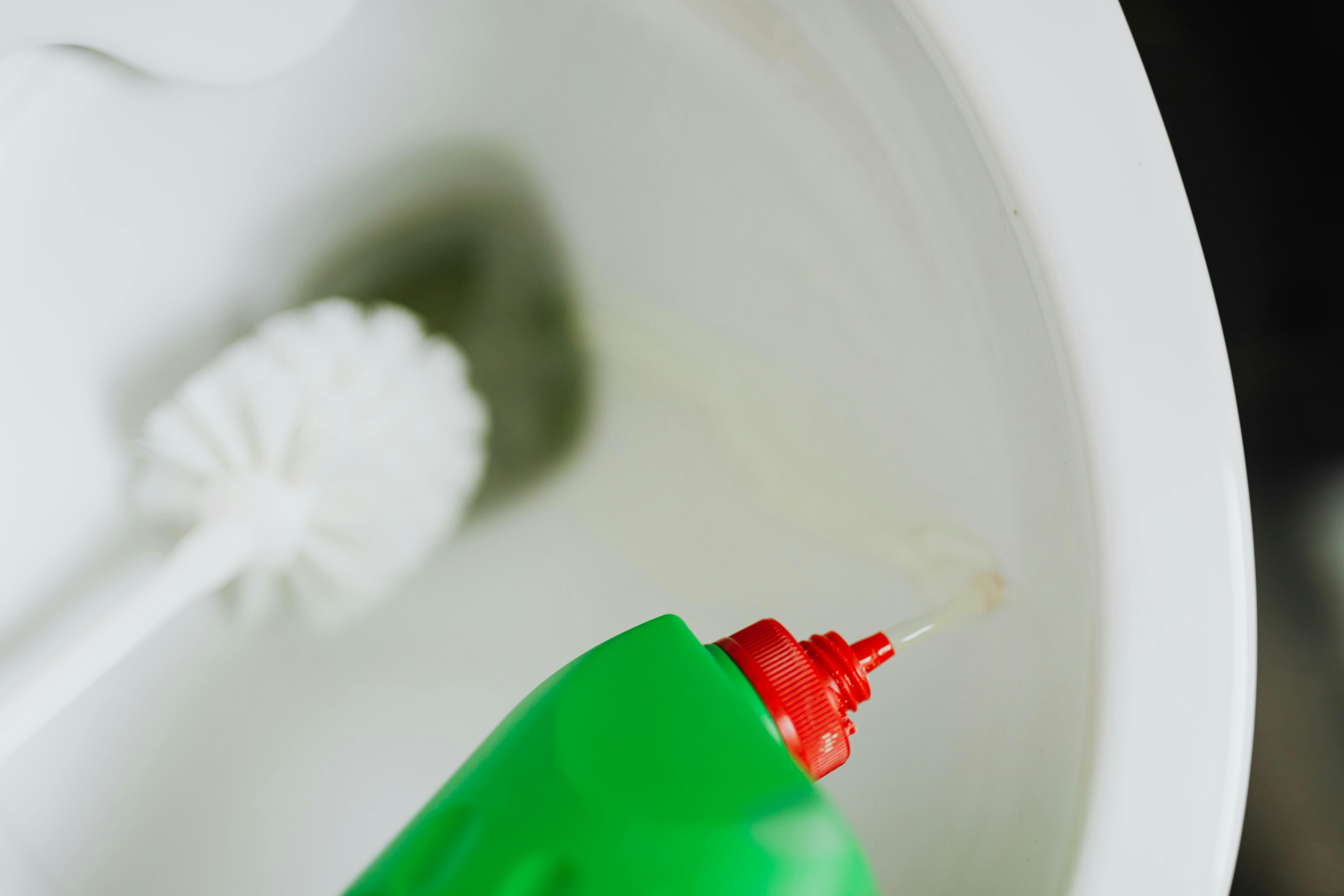 Cleaning a toilet bowl | Source: Pexels