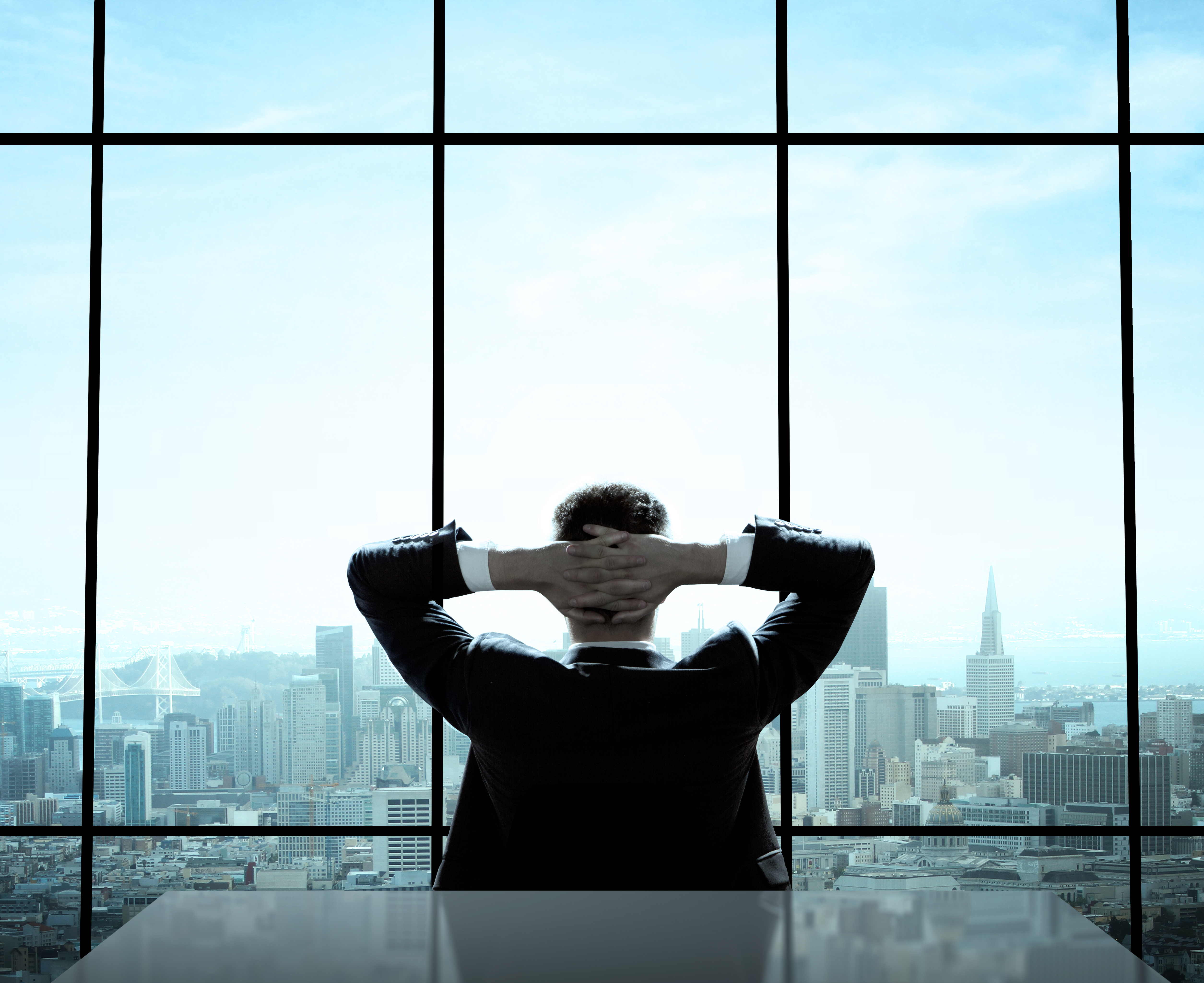 A man sitting in an office | Source: Shutterstock