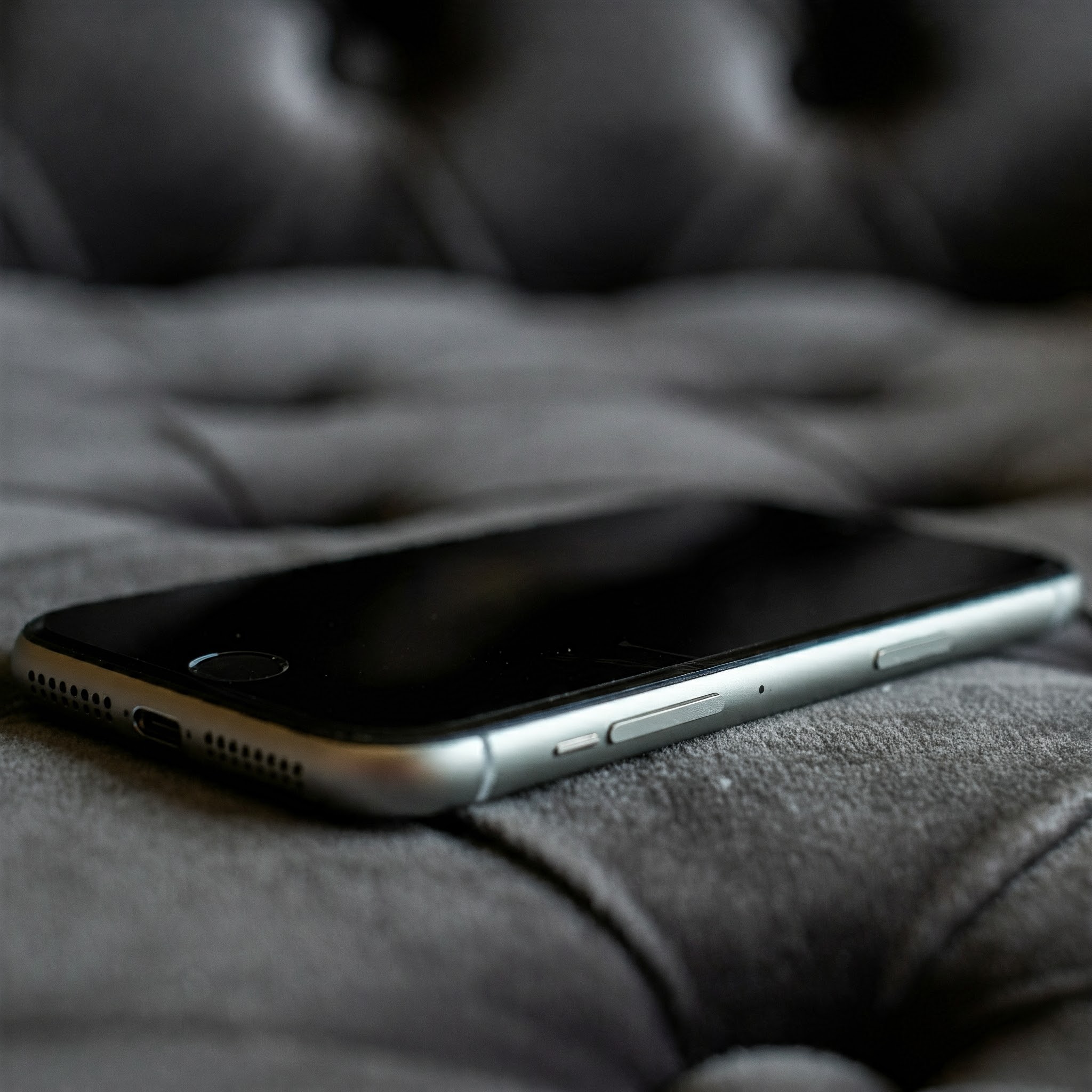 A phone on a couch | Source: Gemini