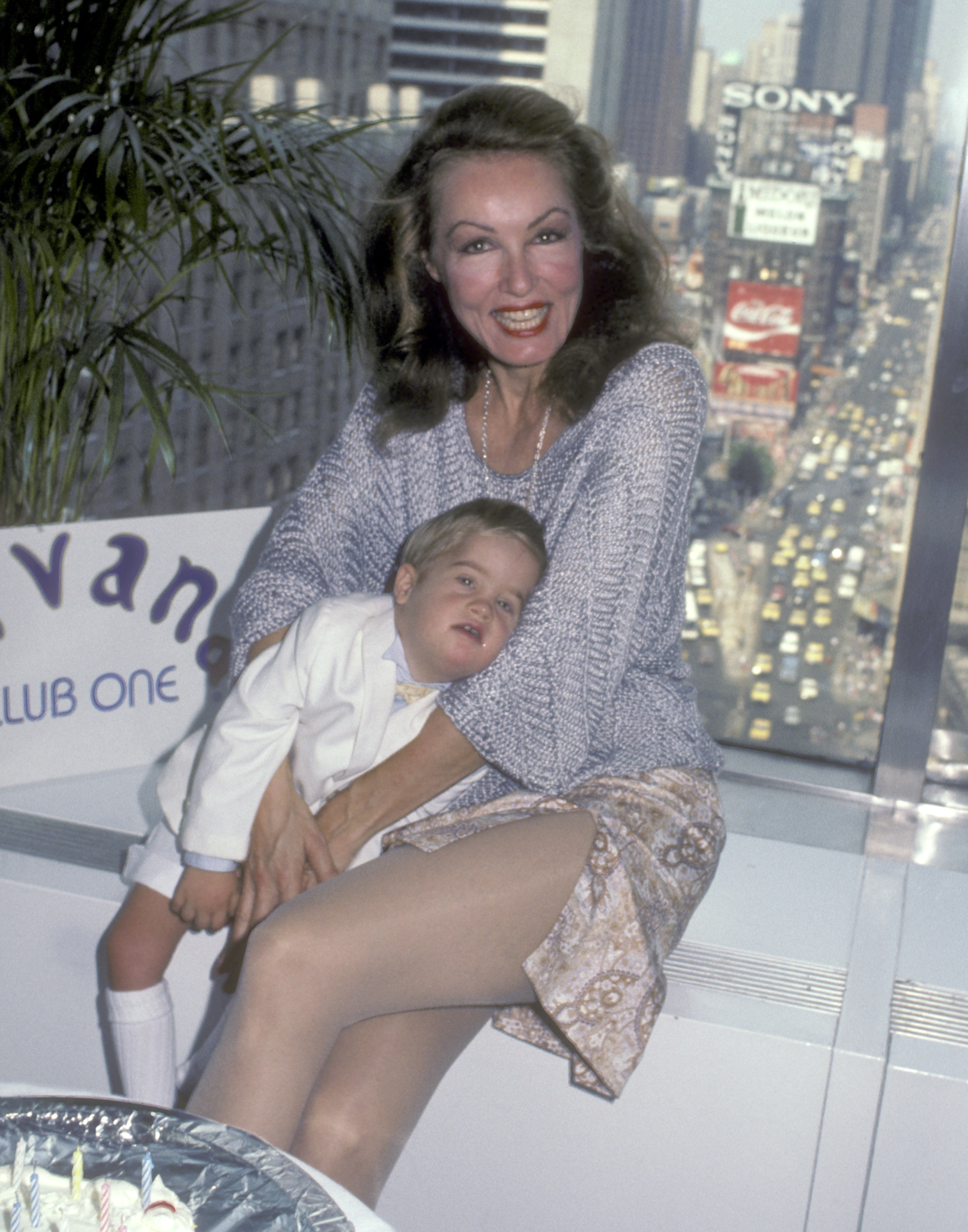 Actress Julie Newmar and son John attend her 51st birthday party on August 16, 1984 at Nirvana Club One in New York City. | Source: Getty Images