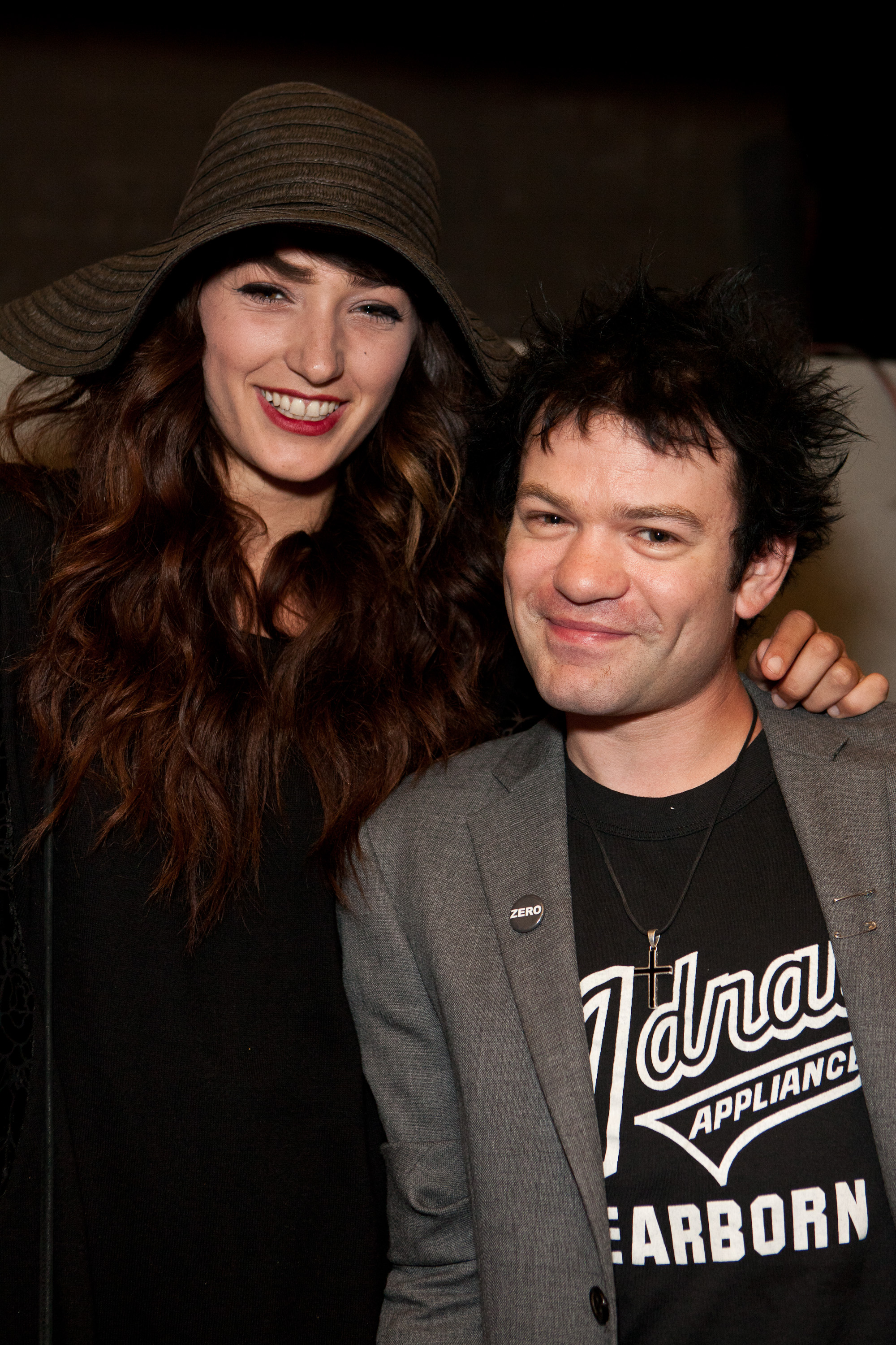 Model Ariana Cooper (L) and vocalist Deryck Whibley of Sum 41 (R) attend the soft opening of The Writers Room, on October 13, 2011, in Los Angeles, California. | Source: Getty Images