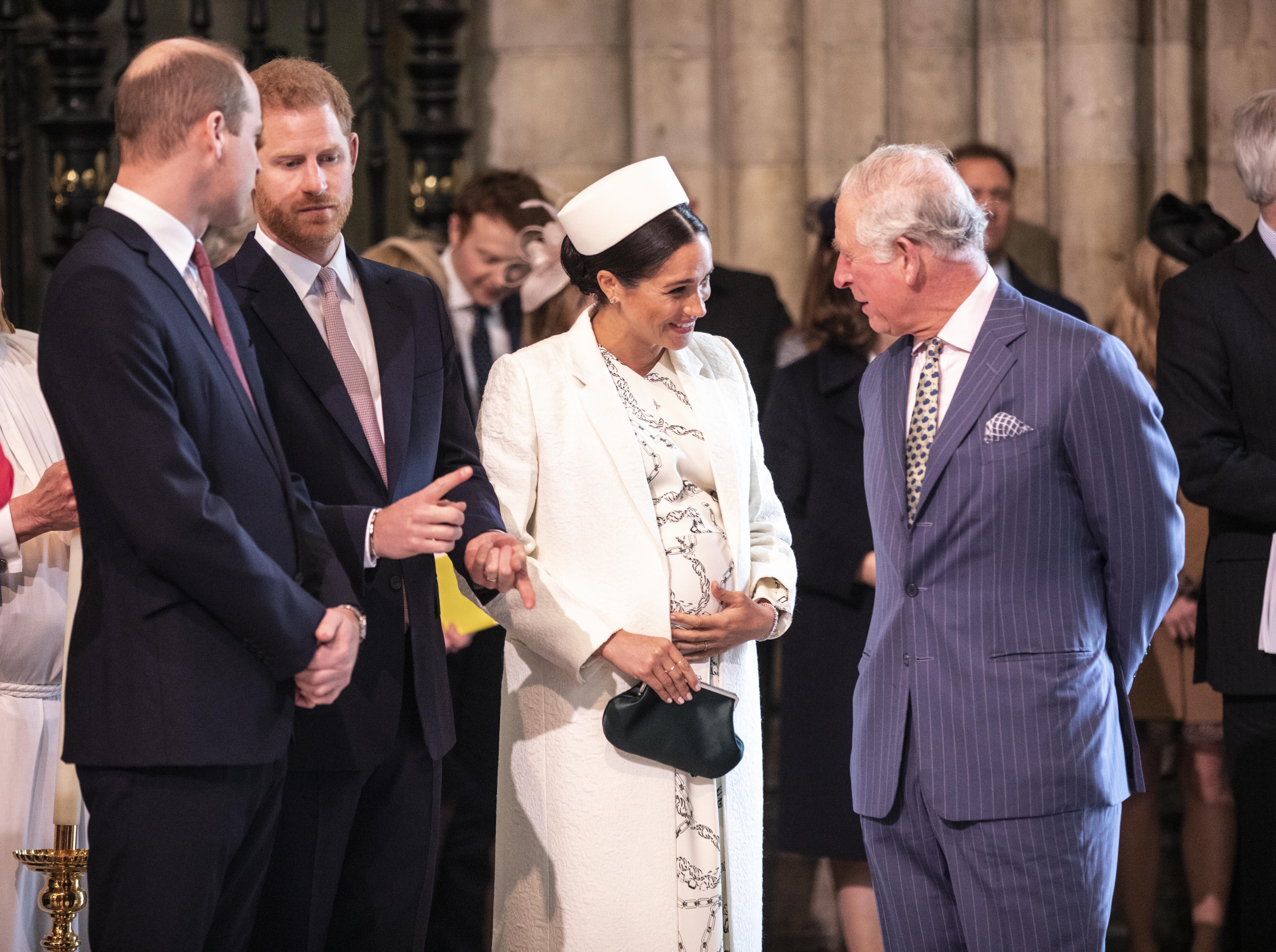 The Duchess of Sussex talks with Prince Charles at the Westminster Abbey Commonwealth day service on March 11, 2019 in London, England. 