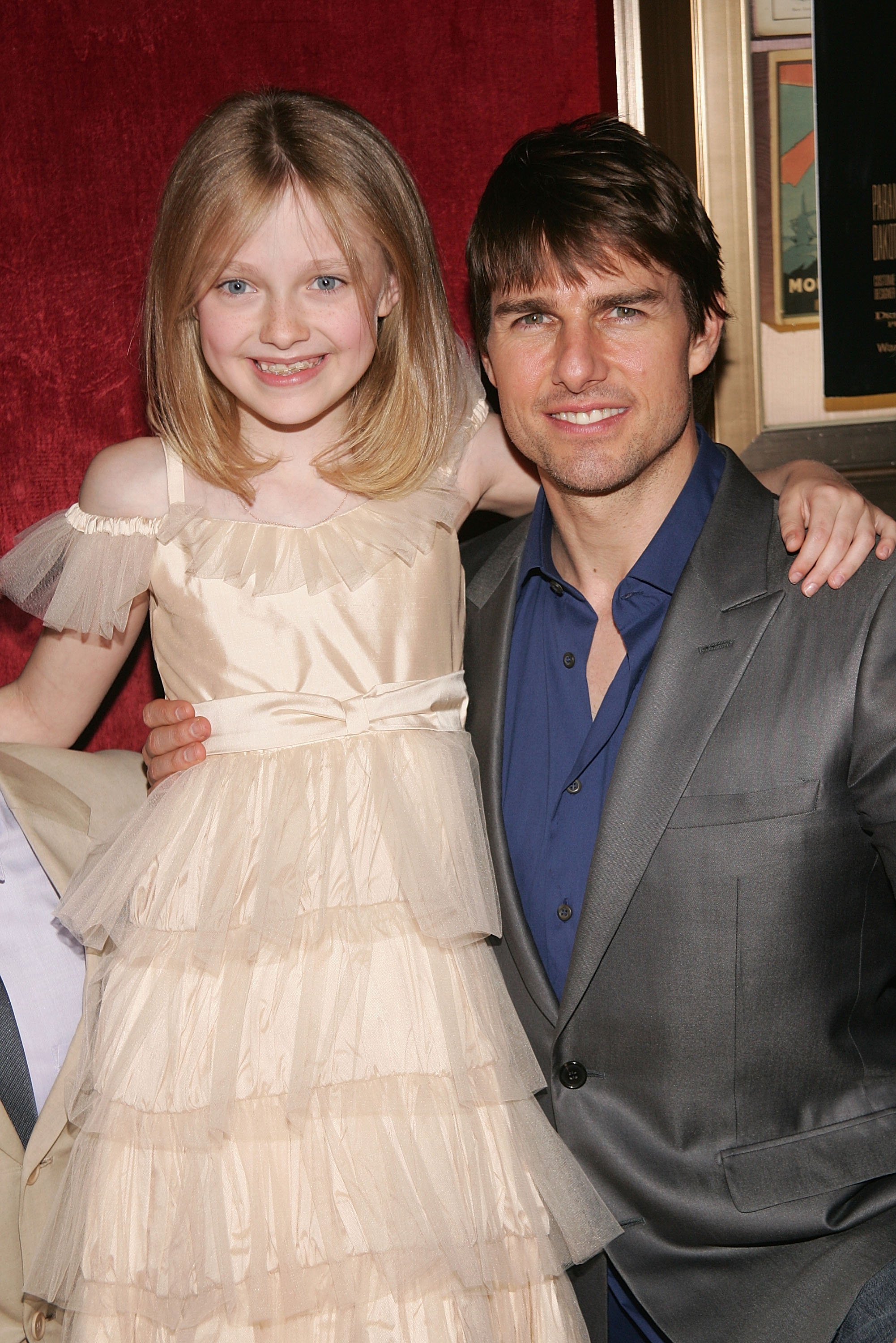 Dakota Fanning and Tom Cruise at the premiere of "War of The Worlds" on June 23, 2005, in New York City. | Source: Getty Images