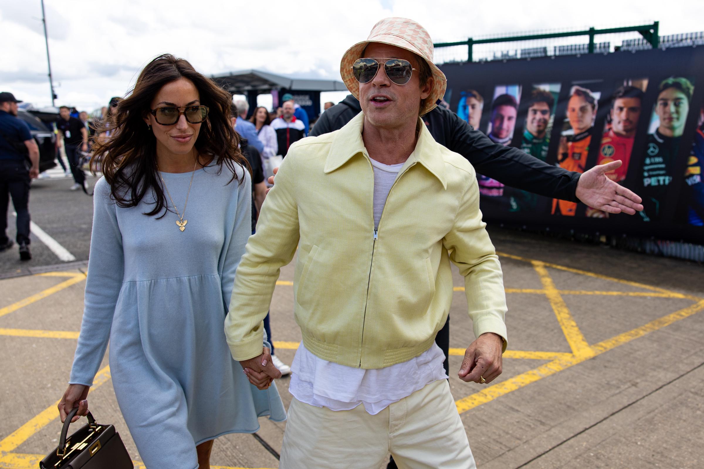 Brad Pitt and Ines De Ramon walk in the paddock during the F1 Grand Prix of Great Britain on July 7, 2024 | Source: Getty Images