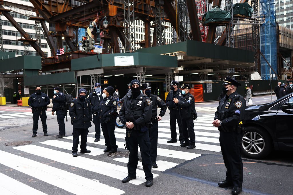 NYPD officers stand at the scene of an incident. | Photo: Getty Images