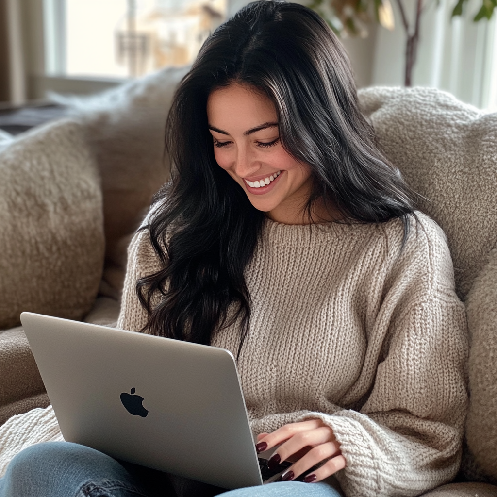 A woman with a sly smirk on her face as she works on her laptop | Source: Midjourney