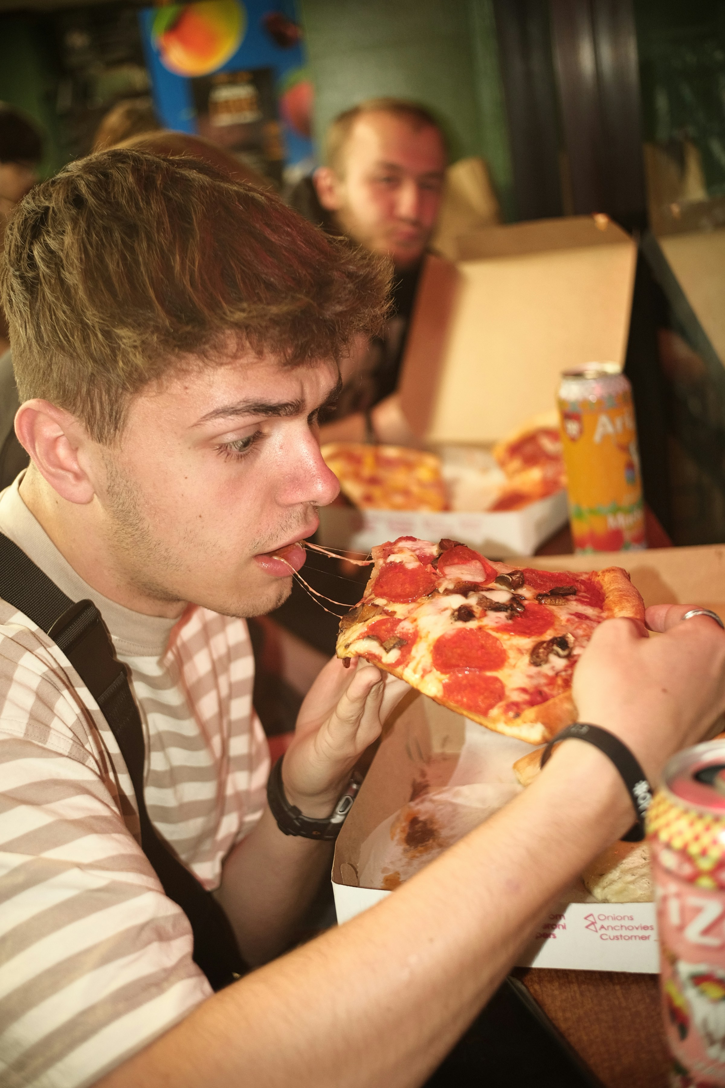 Man eating pizza | Source: Unsplash