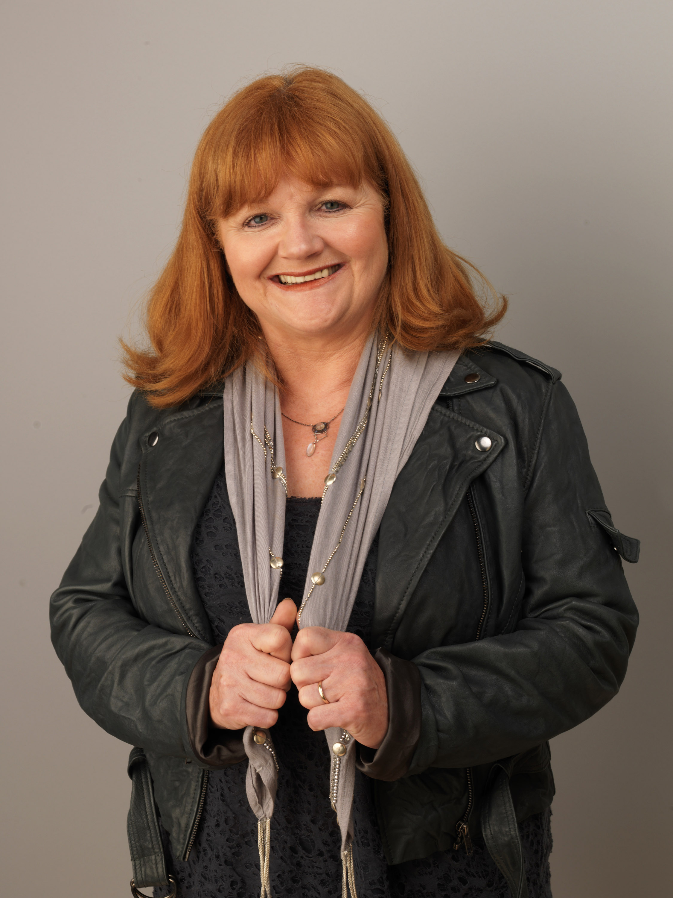 Lesley Nicol posed during the 2010 BFI London Film Festival with her signature red hair styled softly and a cheerful smile. Wearing a grey scarf and leather jacket, she gave off a relaxed and approachable vibe far removed from her stern but lovable "Downton Abbey" character, Mrs. Patmore.