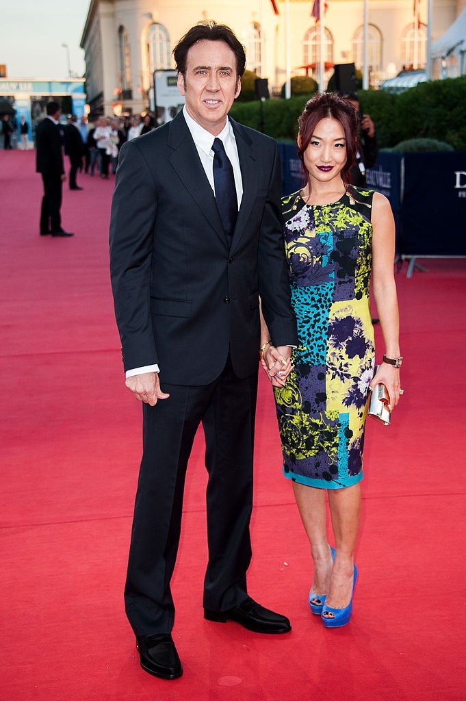 Nicolas Cage and Alice Kim arrive at the premiere of the movie 'Joe' during the 39th Deauville American film festival | Photo: Getty Images