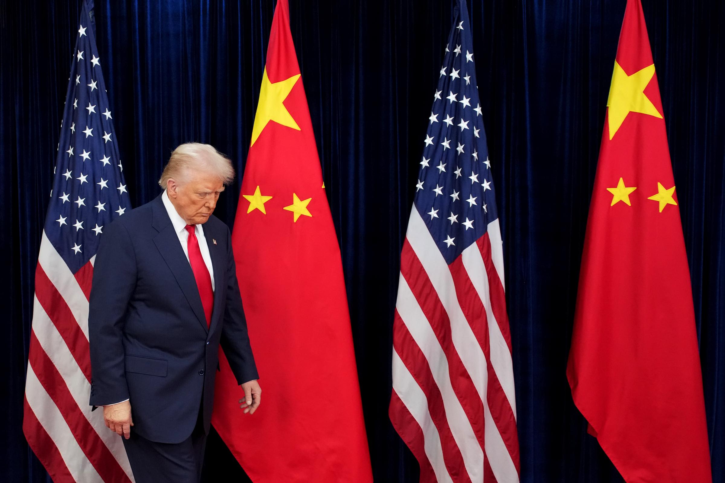 Donald Trump prepares to greet Chinese President Xi Jinping ahead of a bilateral meeting at Gimhae Air Base on October 30, 2025 in Busan, South Korea | Source: Getty Images