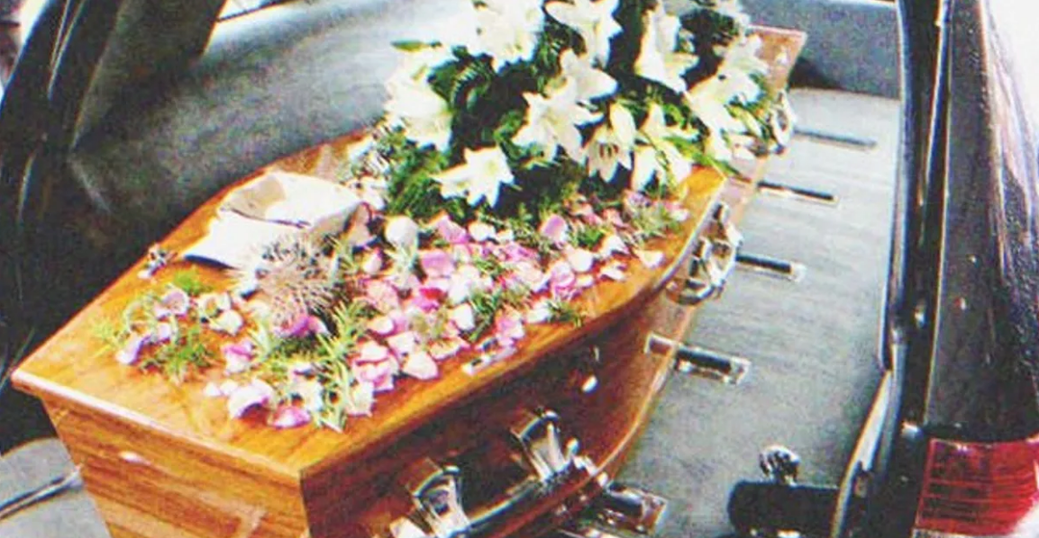 A coffin in a hearse | Source: Shutterstock
