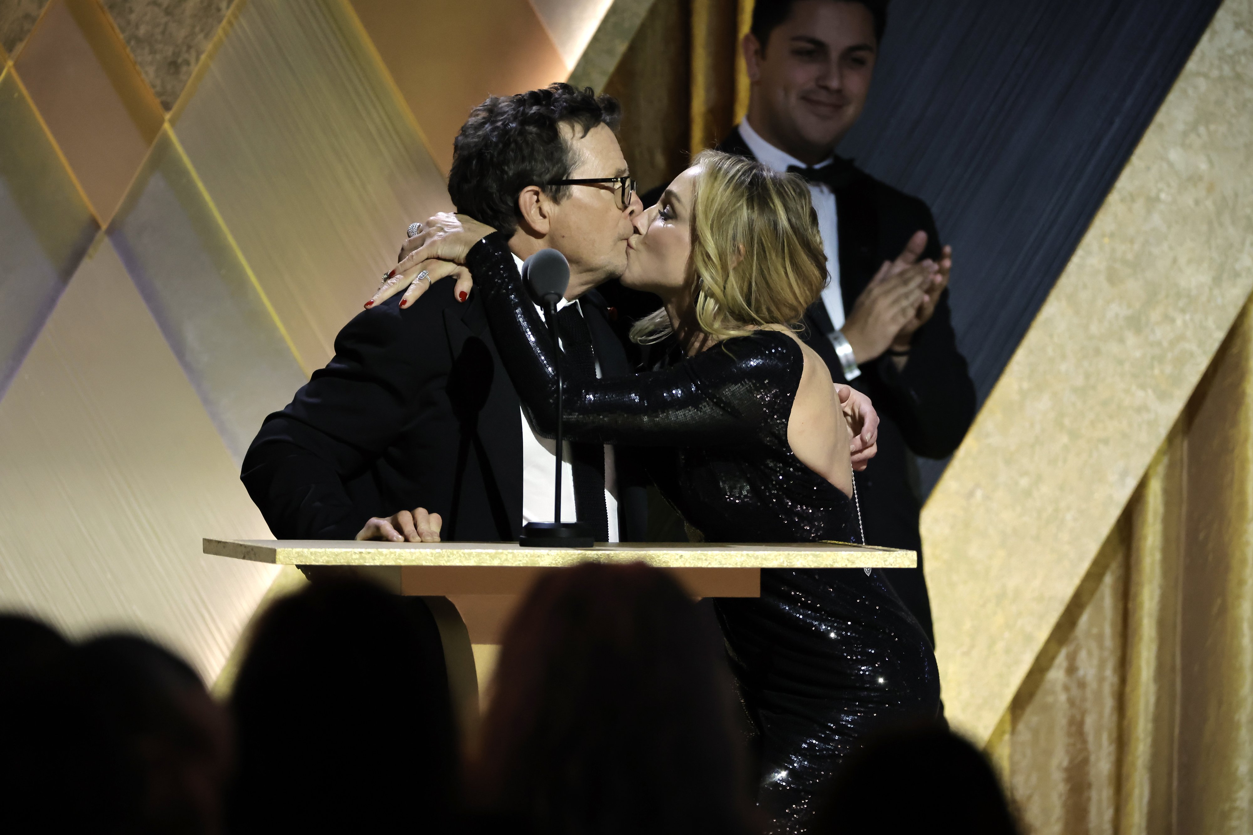 Michael J. Fox kisses his wife, Tracy Pollan onstage during the Academy of Motion Picture Arts and Sciences 13th Governors Awards at Fairmont Century Plaza on November 19, 2022, in Los Angeles, California. | Source: Getty Images