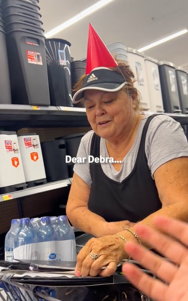 They handed Debra a red birthday hat. | Source: TikTok.com/@neenib