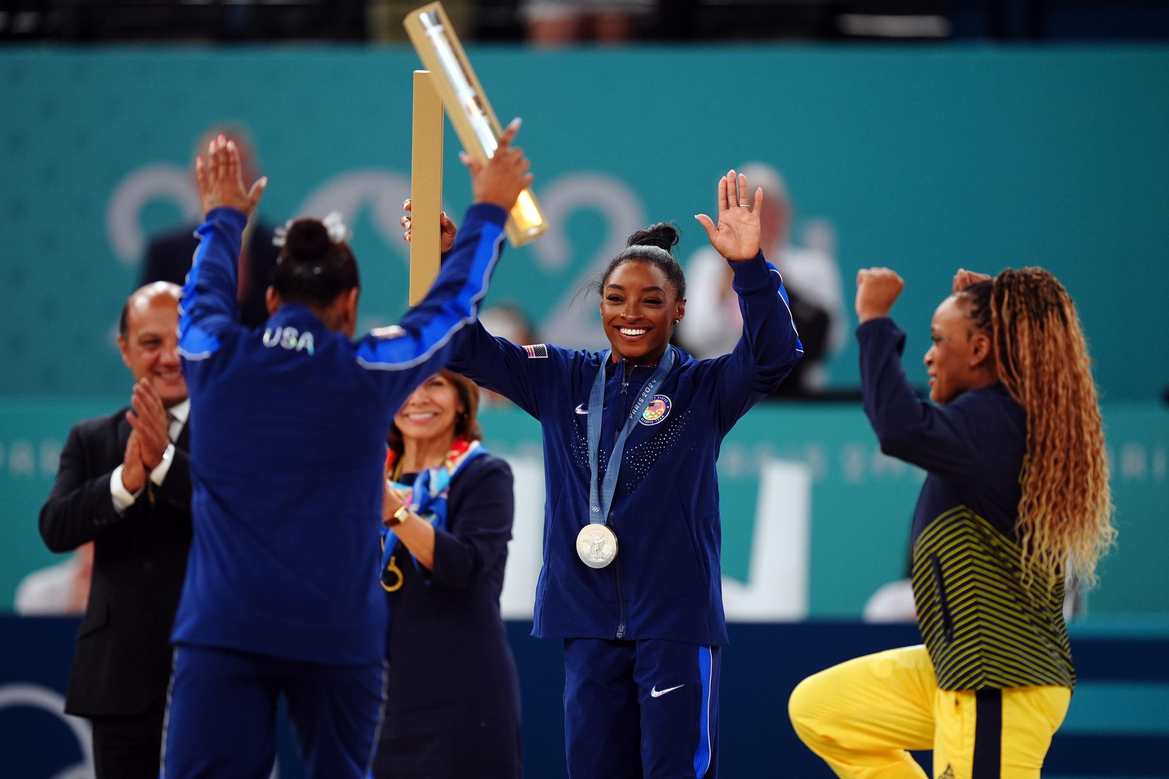 Jordan Chiles, Simone Biles and Rebeca Andrade during the women's floor exercise final medal ceremony at the Paris Olympics in Paris, France on August 5, 2024 | Source: Getty Images