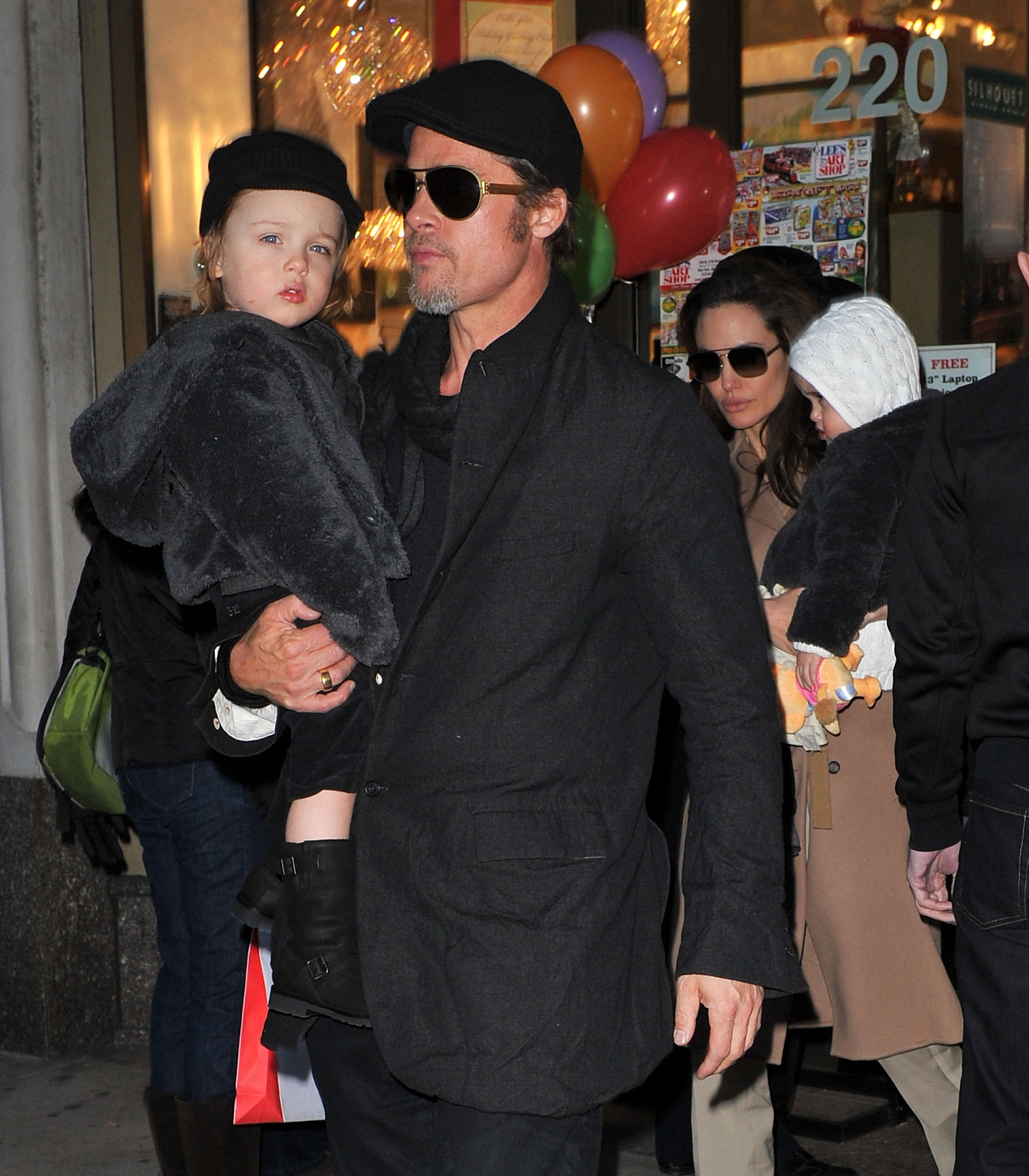 Brad Pitt and Angelina Jolie walks with their children Vivienne and Knox Jolie-Pitt on December 4, 2010, in New York City. | Source: Getty Images