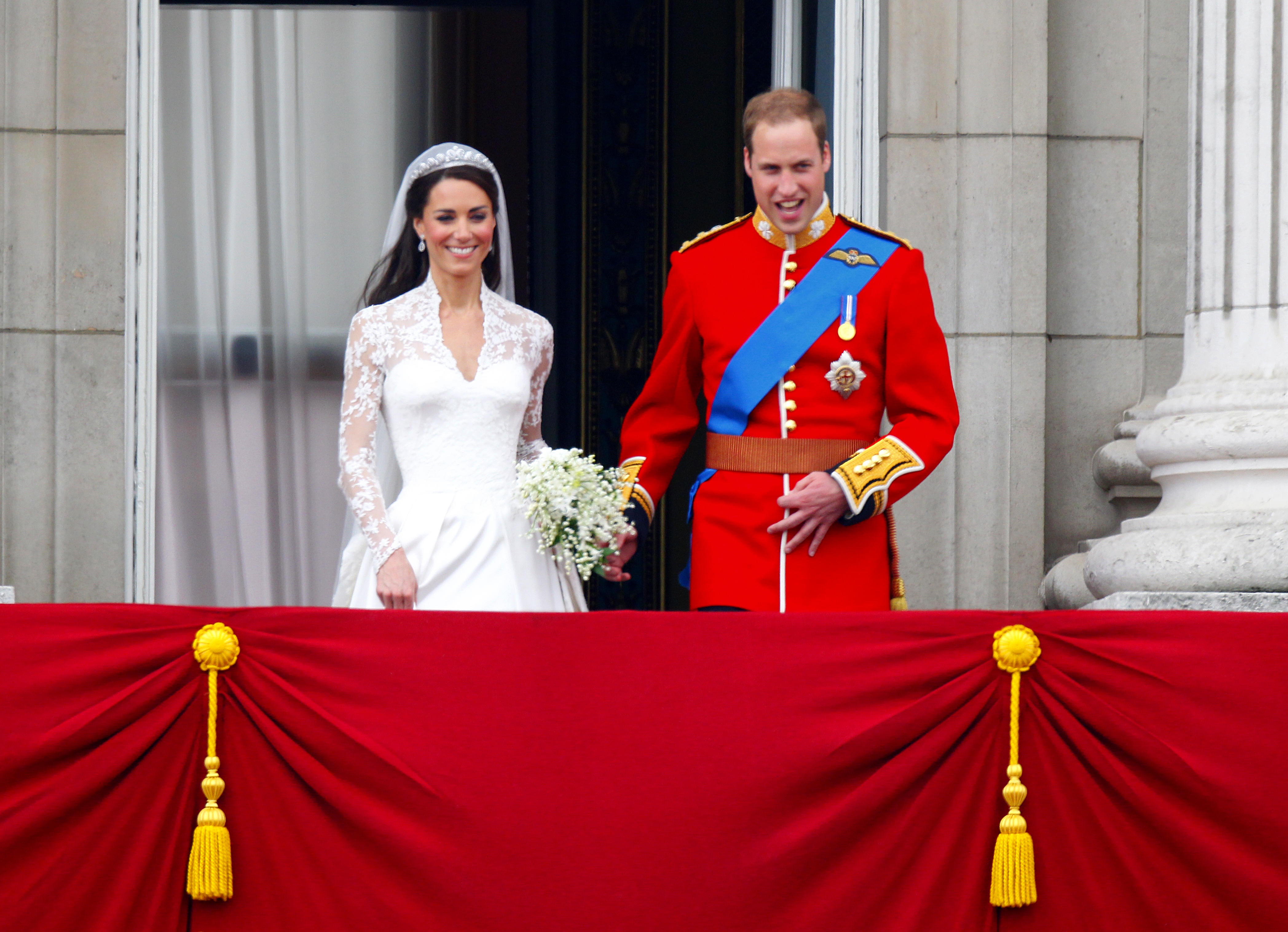 Catherine, Duchess of Cambridge, and Prince William greet the crowd on the balcony of Buckingham Palace in London, following their wedding on April 29, 2011 | Source: Getty Images