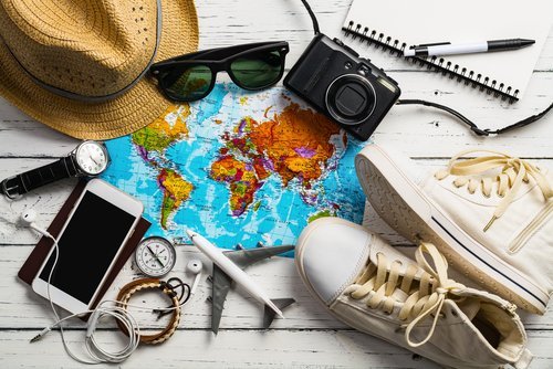 Traveler's accessories, Essential vacation items, Travel concept background. | Source: Shutterstock