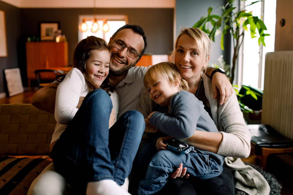 Parents with their cheerful daughters | Source: Getty Images