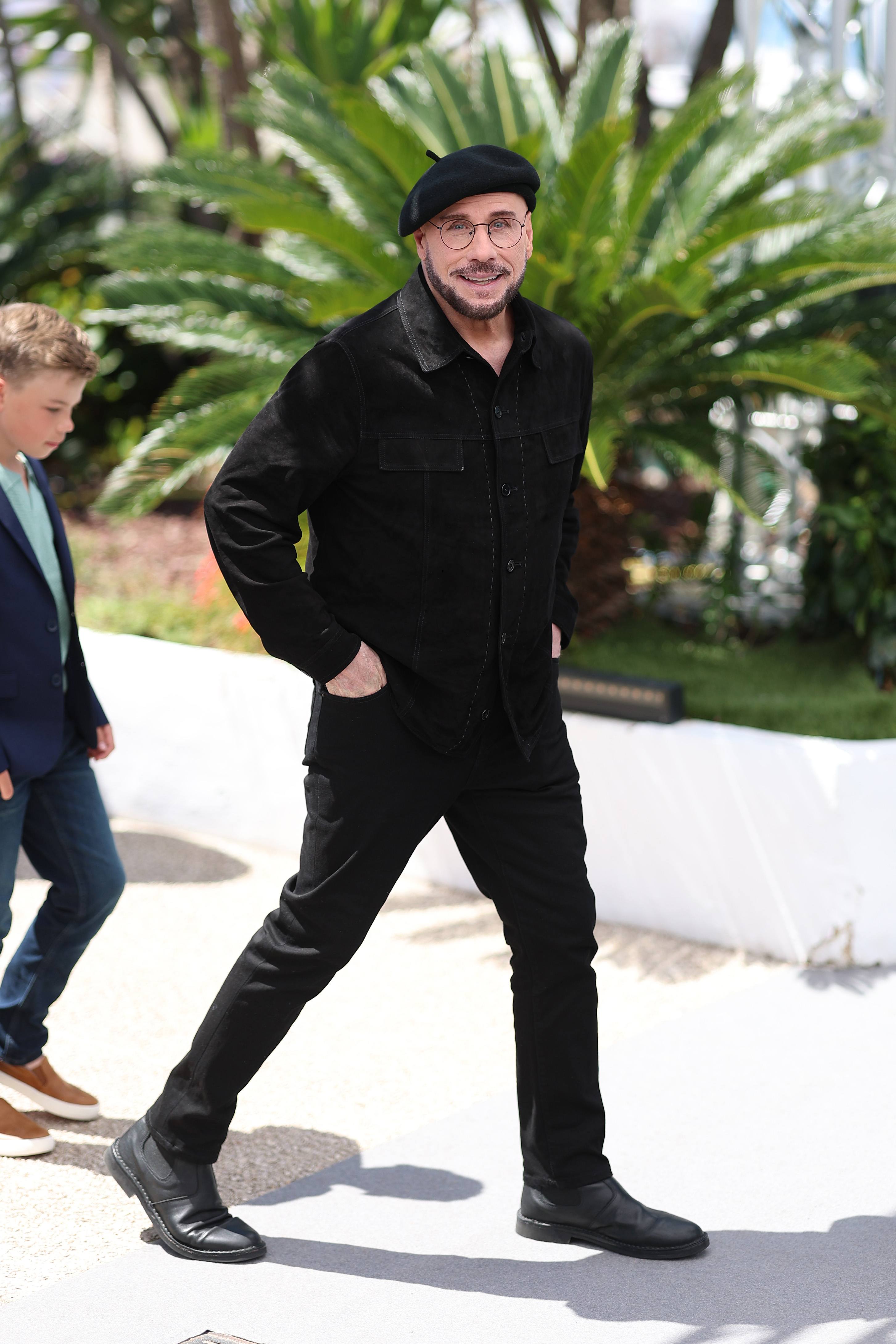 John Travolta poses during the "Propeller One-Way Night Coach" photocall at the annual Cannes Film Festival at Palais des Festivals on May 16, 2026, in Cannes, France | Source: Getty Images