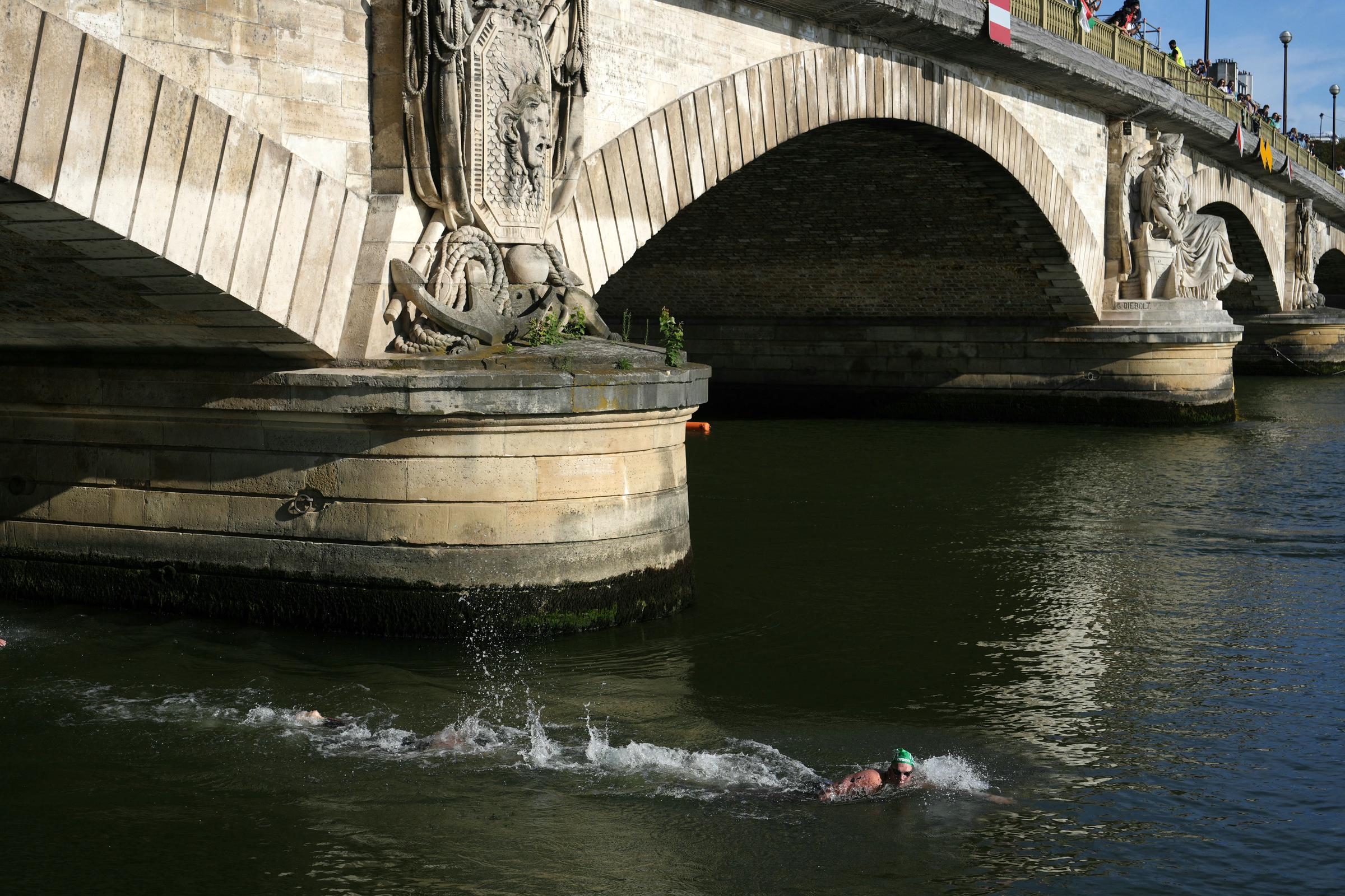 Kristof Rasovszky swims in the Seine River to the finish line during the Men's 10km Marathon Swimming Final at the Paris 2024 Olympic Games on August 9, 2024 | Source: Getty Images