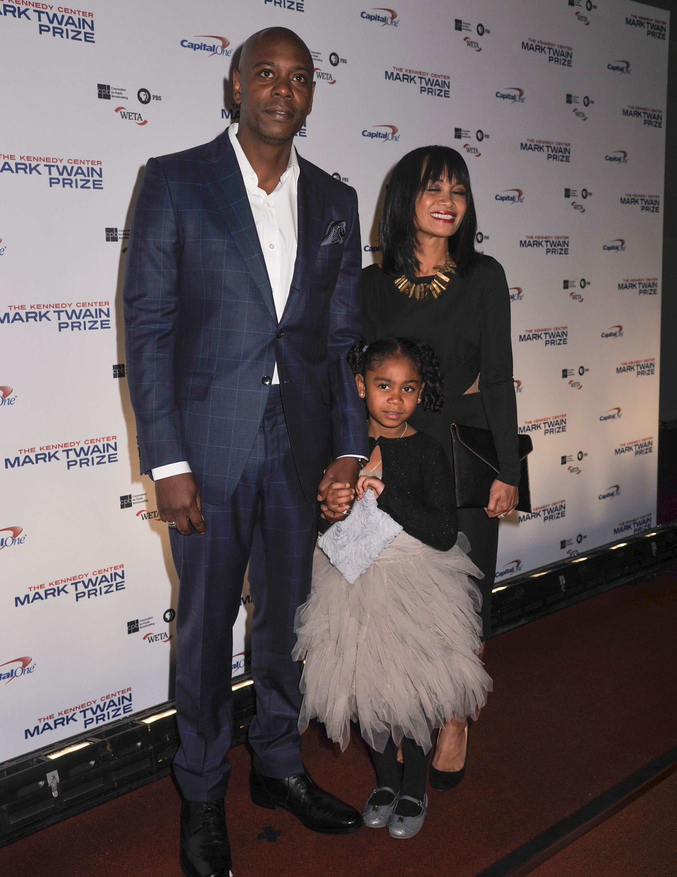 Dave Chappelle, Elaine Chappelle and their daughter, Sonal Chappelle, pose on the red carpet during the 18th Annual Mark Twain Prize For Humor honoring Eddie Murphy at The John F. Kennedy Center for Performing Arts on October 18, 2015, in Washington, DC | Source: Getty Images