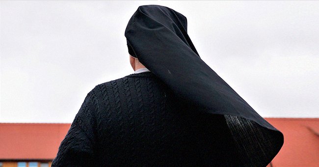 A woman is clad in her black nun uniform | Photo: Shutterstock