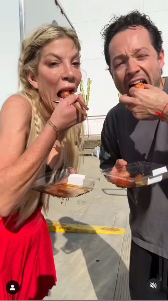 Tori Spelling and Pasha Pashkov eating some sushi, posted on September 24, 2024 | Source: Instagram/pashapashkov and torispelling