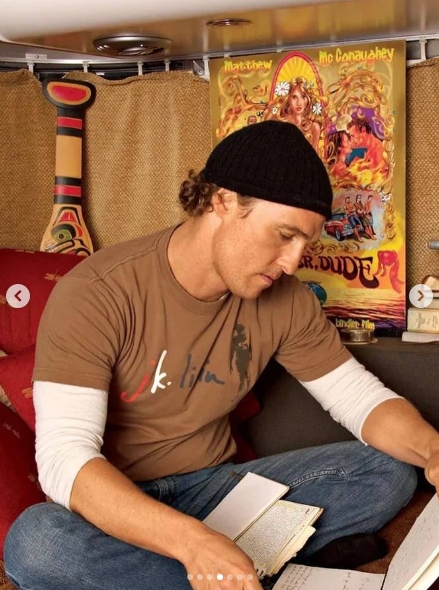 McConaughey made the Airstream distinctly his own, filling its limited space with objects connected to his travels and career rather than leaving it with a conventional RV interior. Seated with notebooks in hand, the actor was surrounded by personal touches, including colorful artwork from "Surfer, Dude," while a decorative paddle recalled the canoe imagery that became central to the trailer's name. | Source: Instagram/ivd_ru