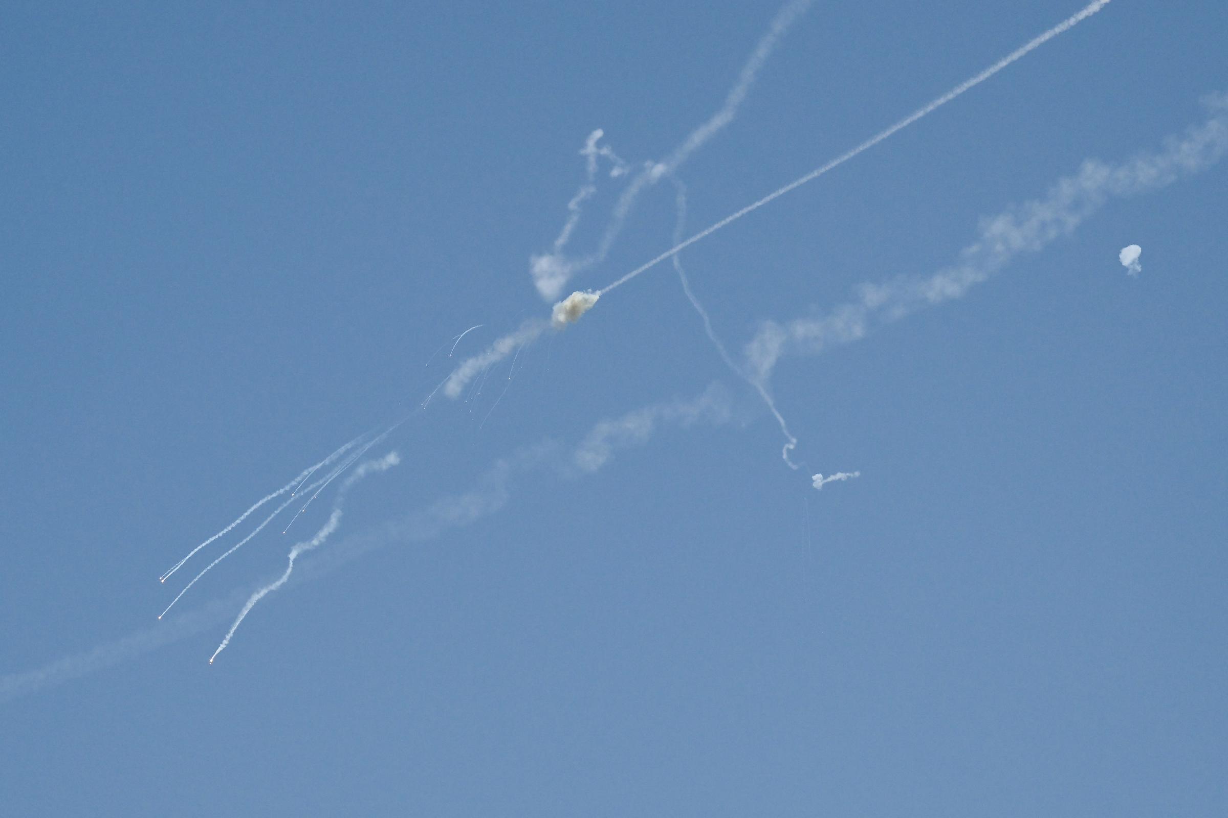 Explosions from the interception of an Iranian projectile are seen in the sky over Dubai on 1 March 2026. | Source: Getty Images