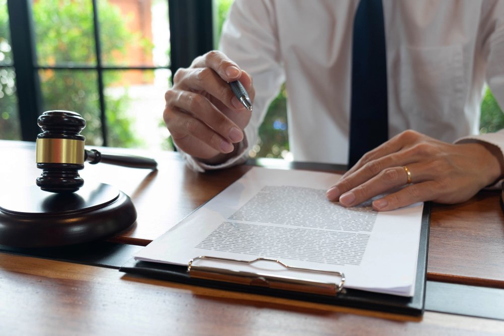 A lawyer going over the alimony agreement | Shutterstock