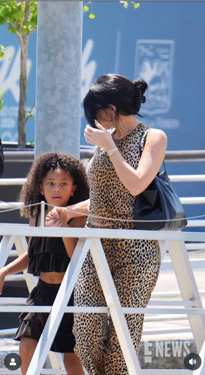 Stormi Webster holds her mother, Kylie Jenner's hand tightly while navigating the steps in Venice, as Kylie briefly touches her hair, posted on June 30, 2025 | Source: Instagram/enews